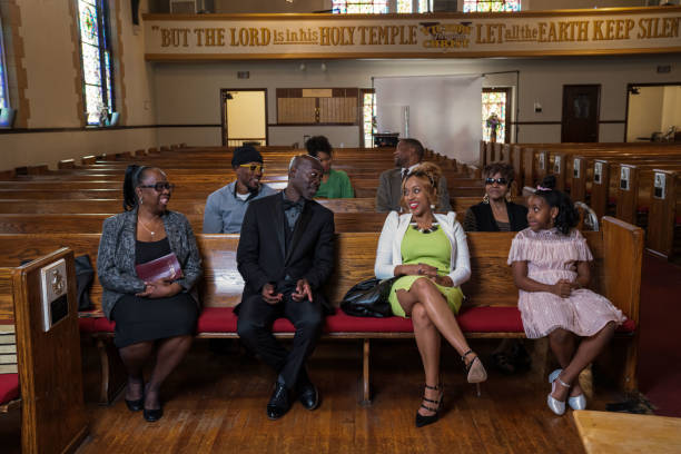 Group of African Americans attending church and listening to a pastor speak. Group of African Americans attending church and listening to a pastor speak.